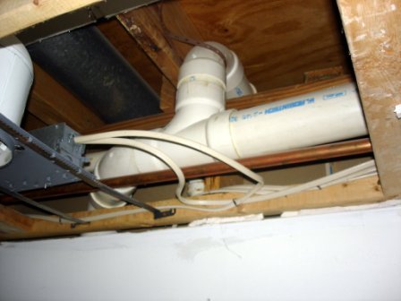 Inspecting_a_soffit_finding_pipes