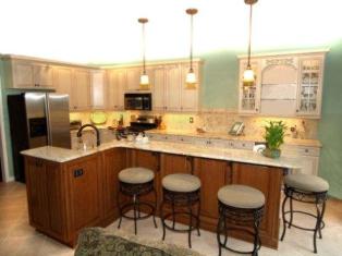 Kitchen with undercabinet lighting, pendant and uplighting.