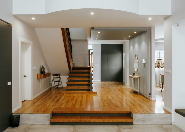 home single step - brown wooden staircase near white wooden door
