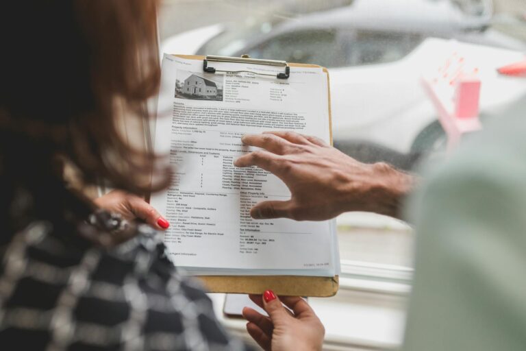 interior designer client meeting holding a proposal document