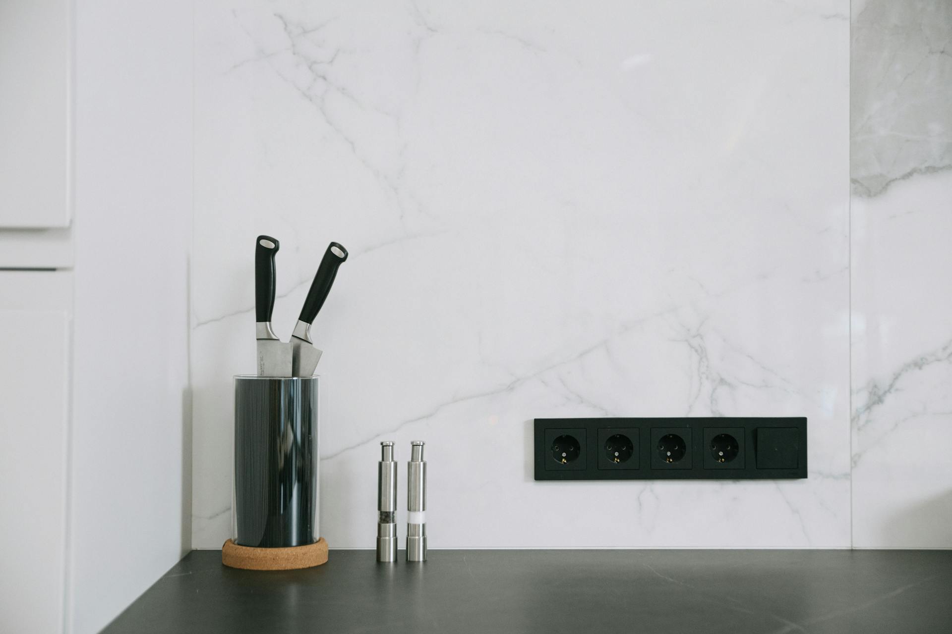 photo of a concealed kitchen outlet and a set of knives