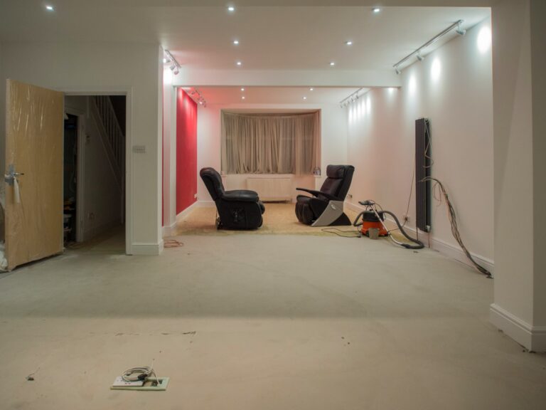basement before full remodeling with two armchairs