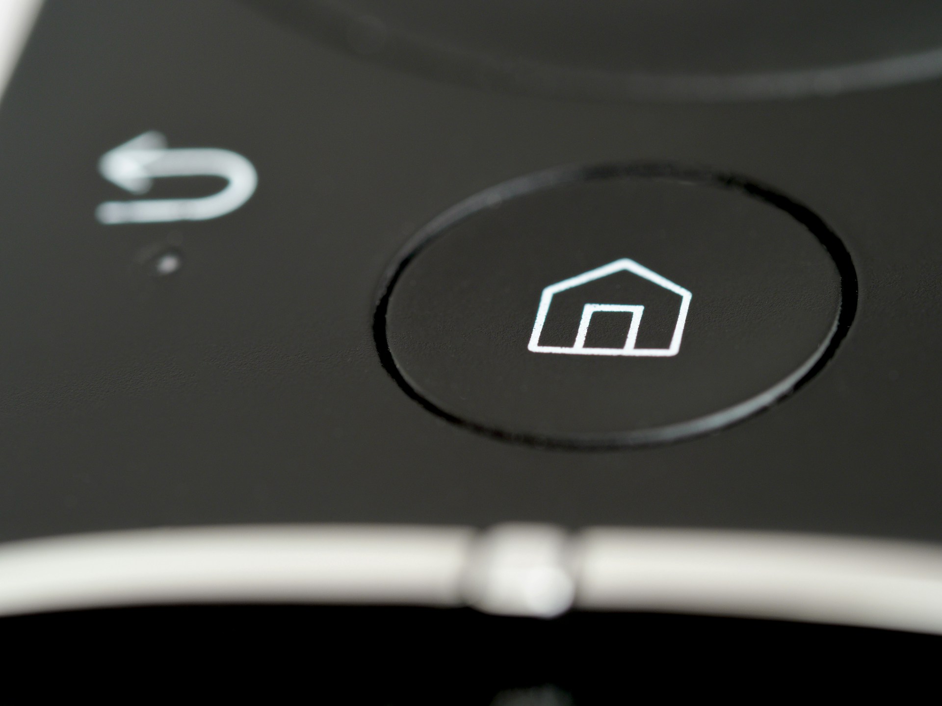 Photo display a device button with a home icon