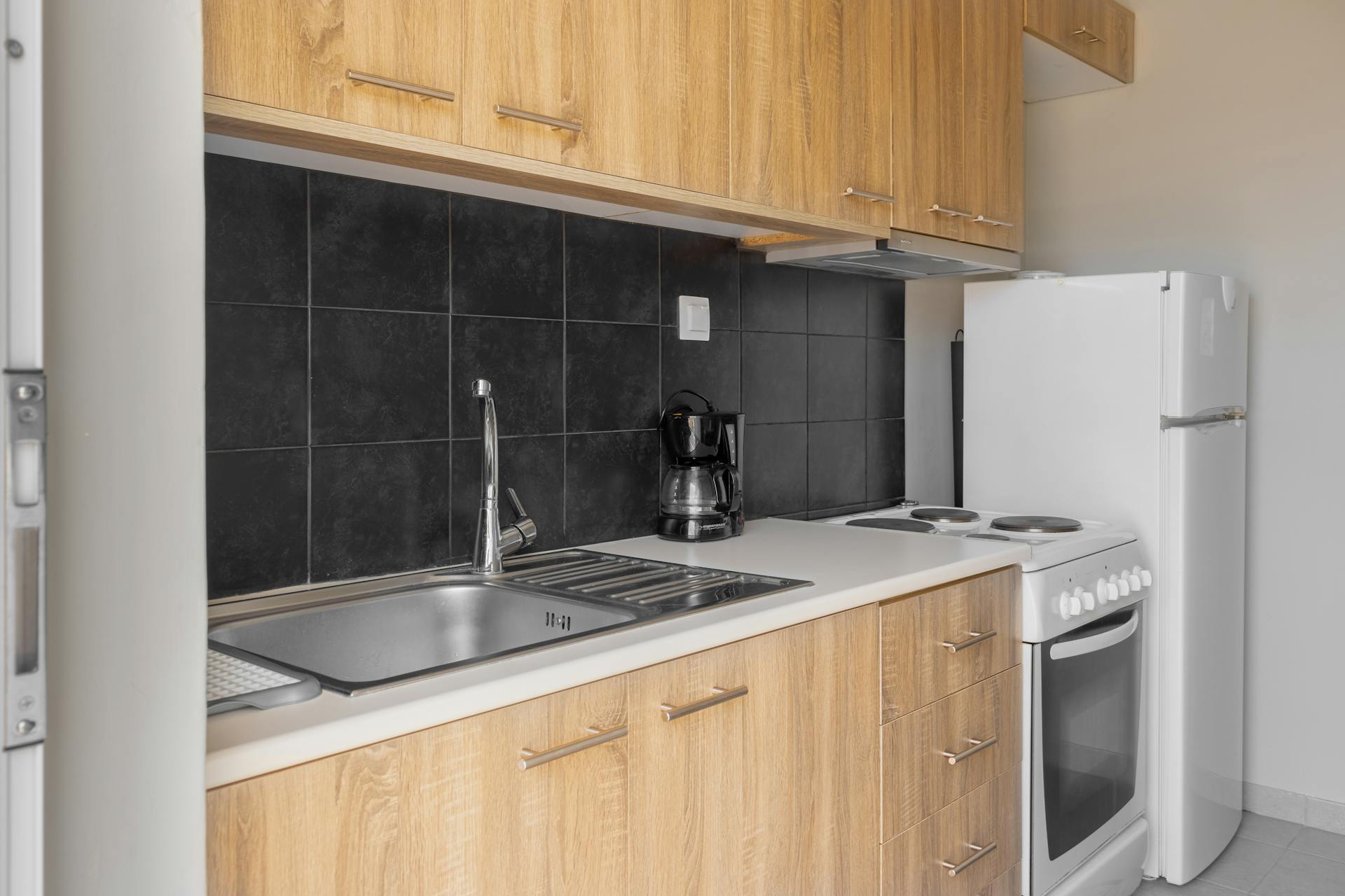 kitchen cabinetry brown cabinets and a sink