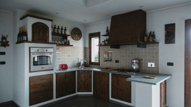 A kitchen with a stove, sink, oven and cabinets photo