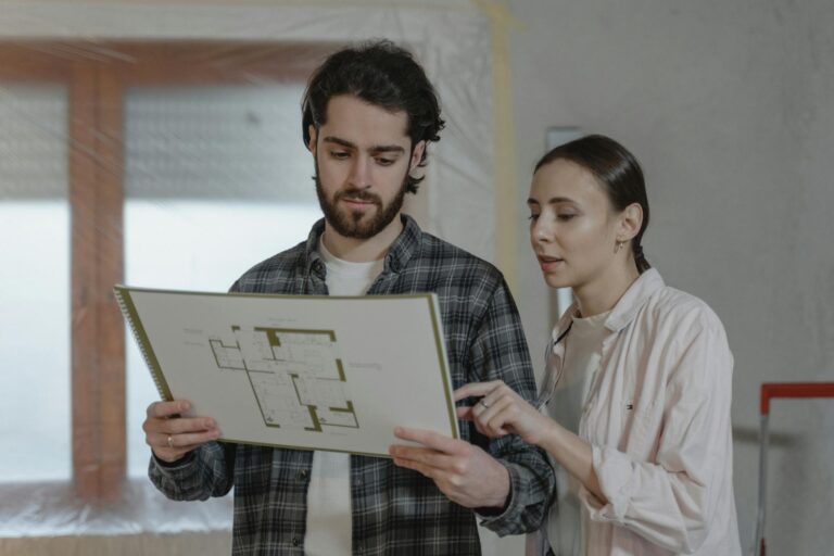 A Couple Discussing About Floor Plans