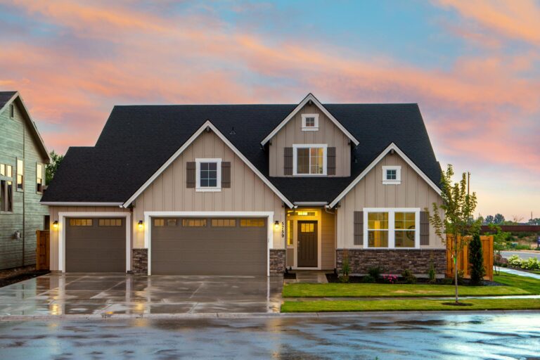 Brown and Gray Painted House with room above the garage