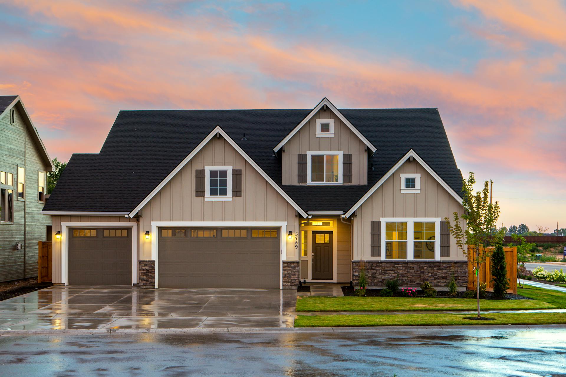 Brown and Gray Painted House with room above the garage