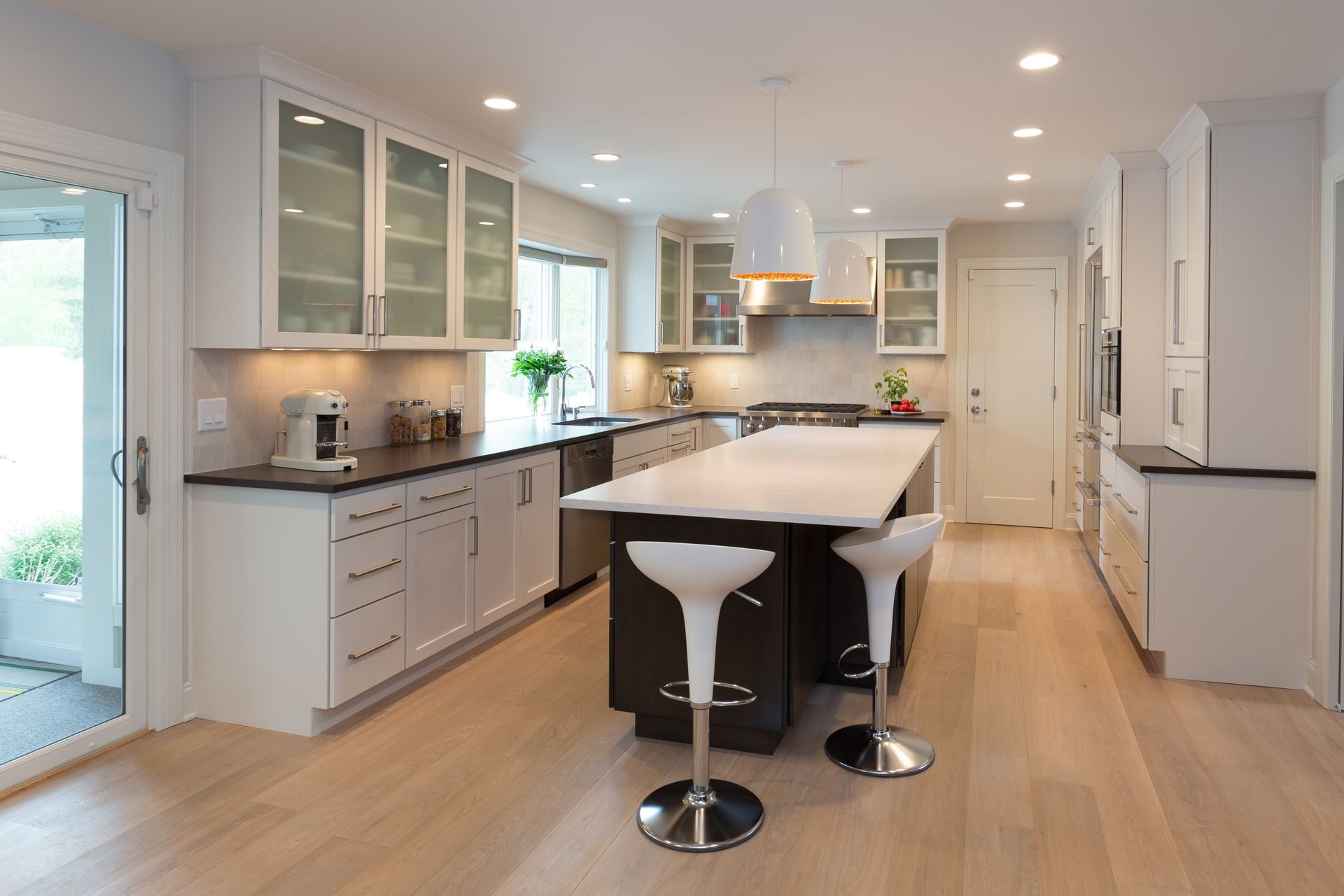 Kitchen Remodeling - Lighting Design & Smart Home Automation. Contemporary kitchen with clean lines and white cabinetry.