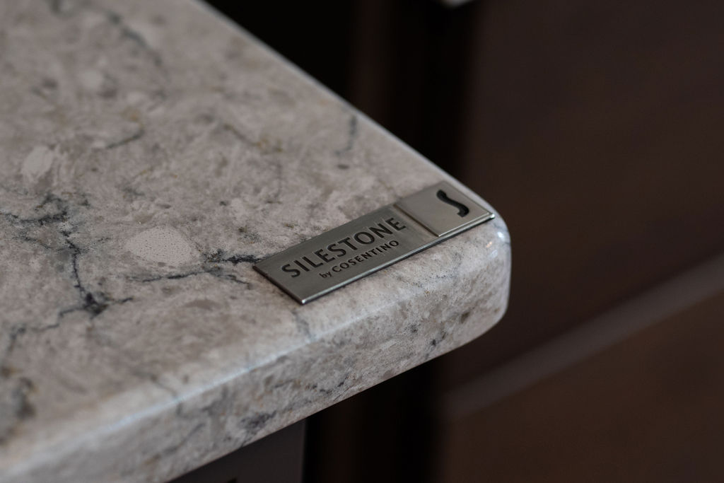 A photo showing the corner of a material with the brand label