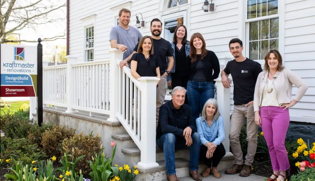 The KraftMaster Renovations team standing outside their New Jersey showroom.