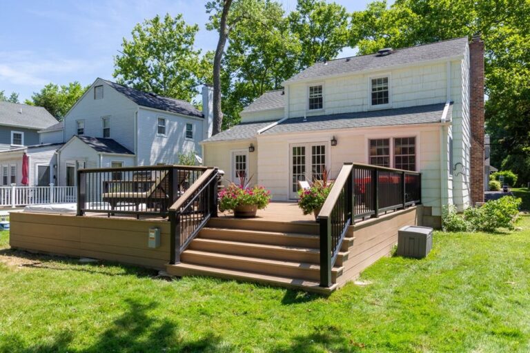 Suburban home with a newly built backyard deck, showing a thoughtful home improvement instead of relocation