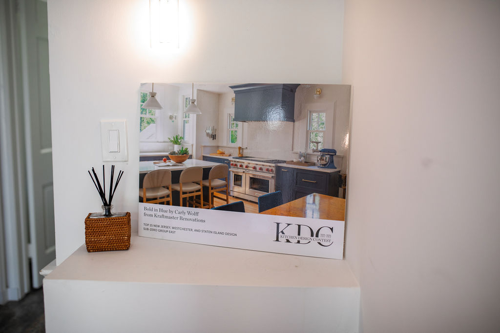 KraftMaster Renovations kitchen project featured in KDC award display with Sub-Zero recognition