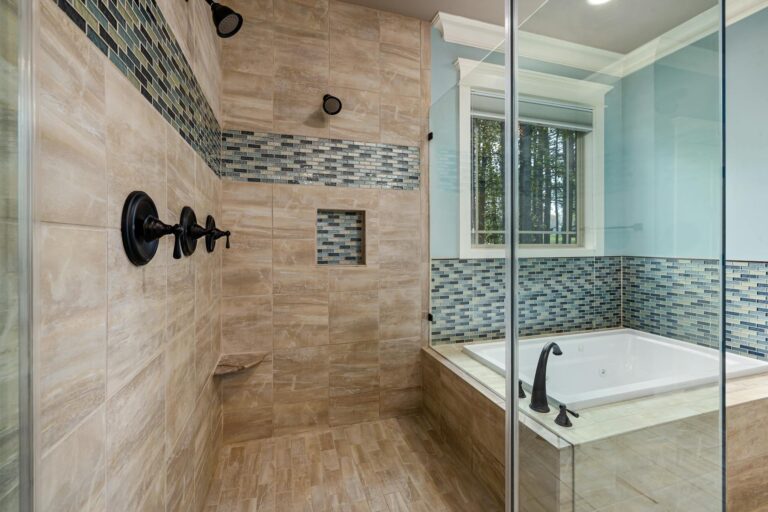 Walk-in shower with multiple shower heads and textured tile accent wall