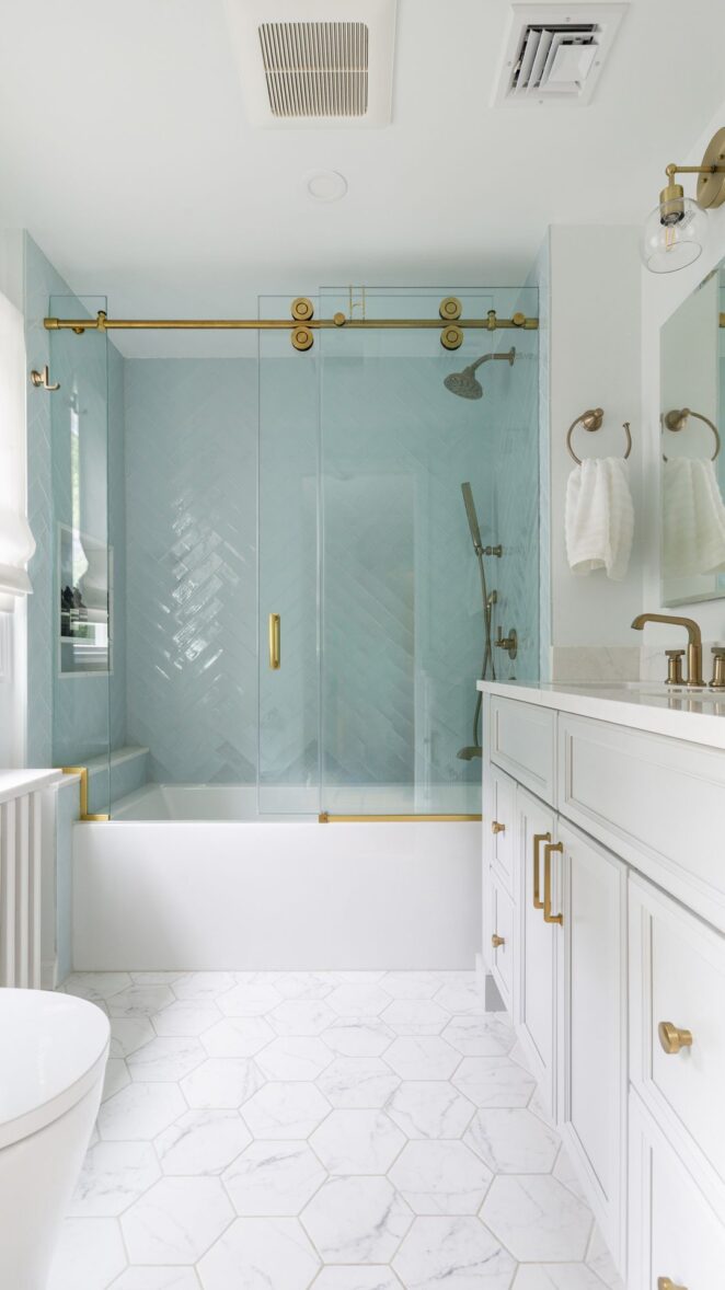 Spa-Inspired Kids' Bathroom with Sea-Glass Tile, Brass Accents, and Timeless Storage Solutions