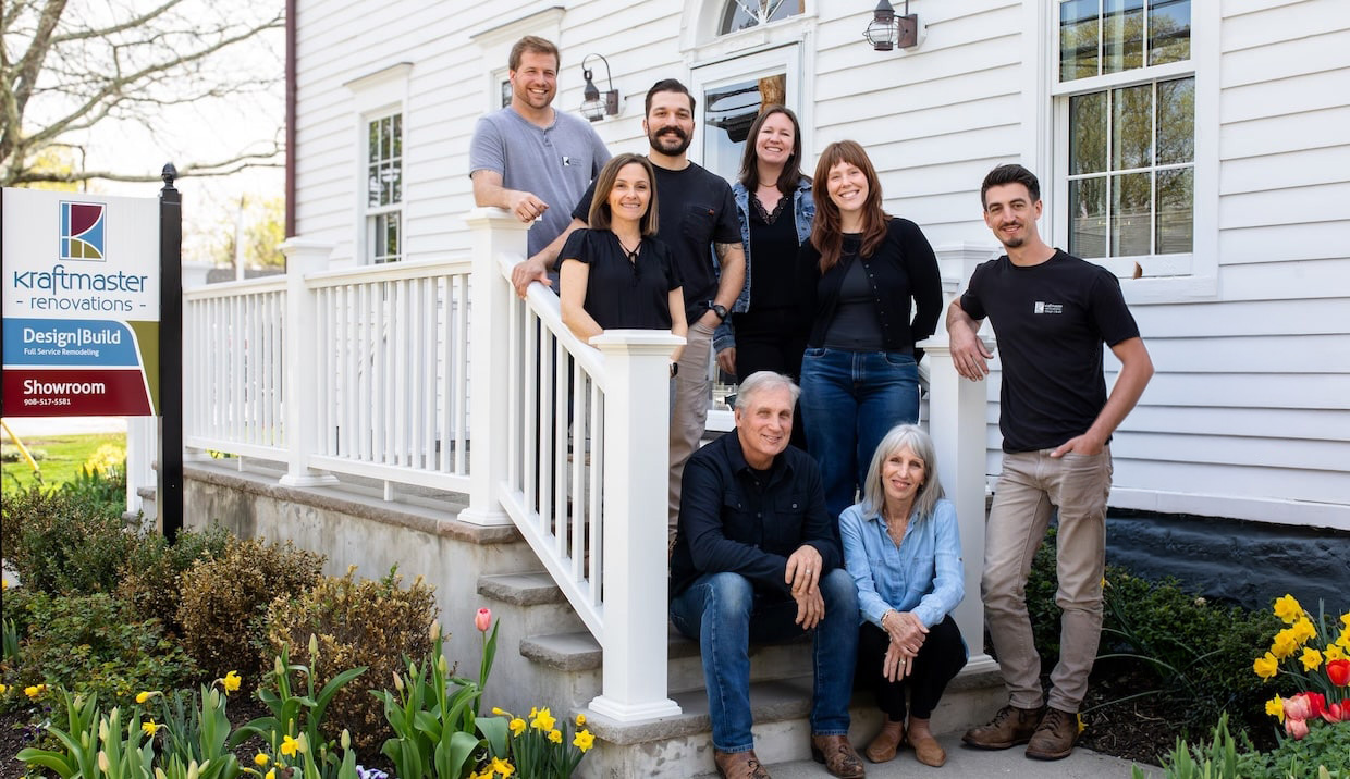 The KraftMaster Renovations team standing outside their New Jersey showroom.
